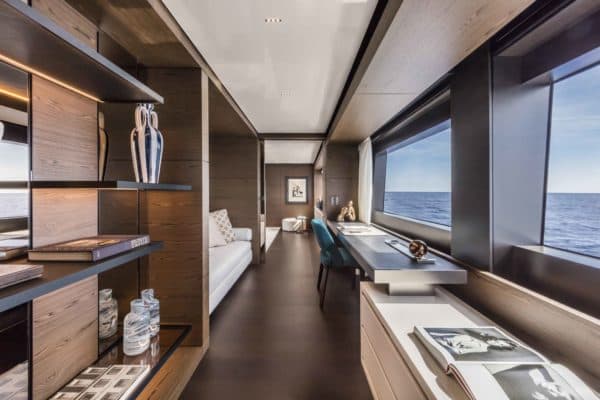 The master suite is forward on the main deck and features a stunning hallway with a private lounge and study