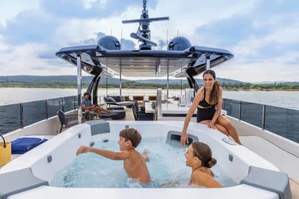 The sun deck features an outdoor jacuzzi and a covered socialsing area