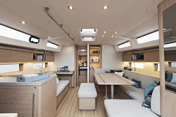 The spacious interior allows for an entire crew around the dinette, while natural light comes from an abundance of portlights and skylights