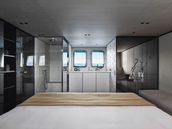 The master suite features a starboard-facing bed and an elegant, open-design bathroom