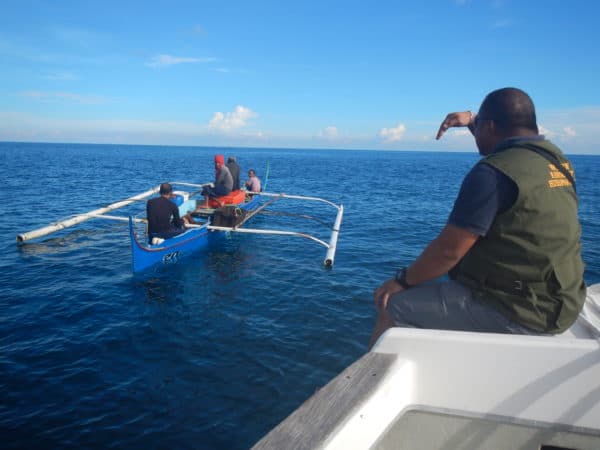 A Reef Guardian Honorary Wildlife Warden stops a boat suspected of illegal fishing activity within SIMCA