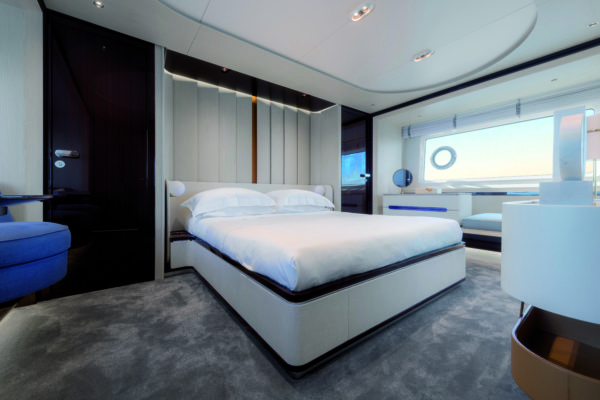 The full-beam owner’s suite enjoys great natural light from the large hull windows and features beautiful furniture design throughout
