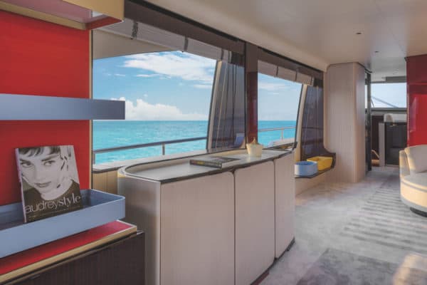 Achille Salvagni has put his stamp on another Grande interior, with splashes of red accenting otherwise neutral tones