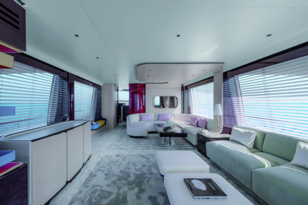 The saloon can feature a formal dining table or an extended seating area with adjustable table (above);