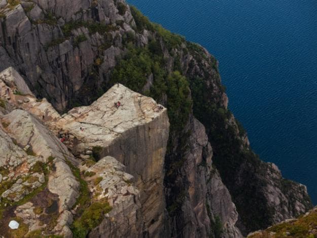 Preikestolen is a steep cliff that rises 604m and offers remarkable views from its flat top