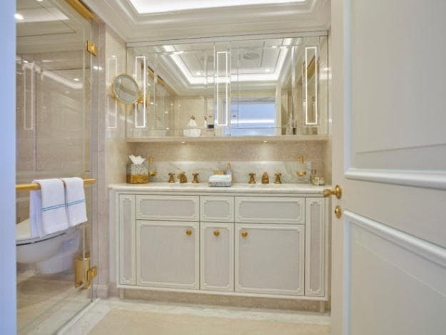 Custom vanity, linen and accessories in the bathroom continue the bamboo theme