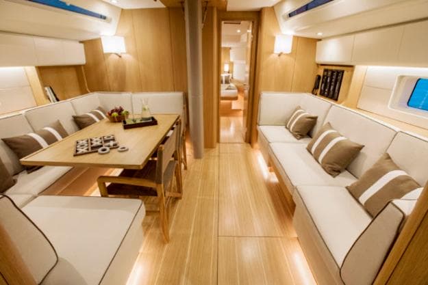 The chart table disappears under the starboard sofa for extra seating room