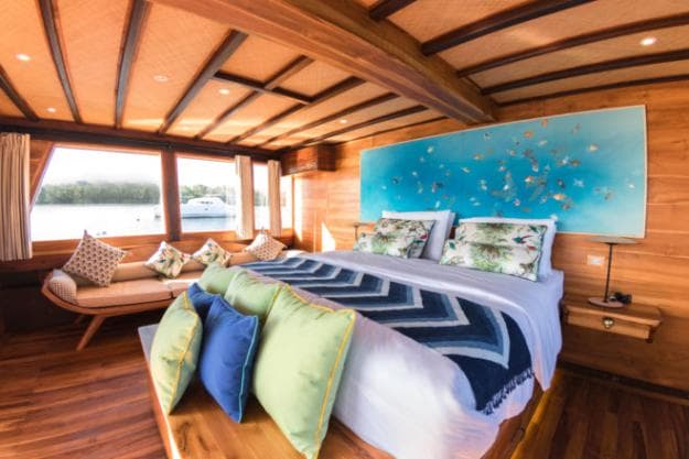 The master suite on Magia II faces an aft private deck with jacuzzi