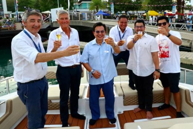Theseira (third right) with the owner (centre) of a new Aquila 36 and his two sons (far right), plus Simpson Marine's Francois Sebire (left) and company founder Mike Simpson (second left)