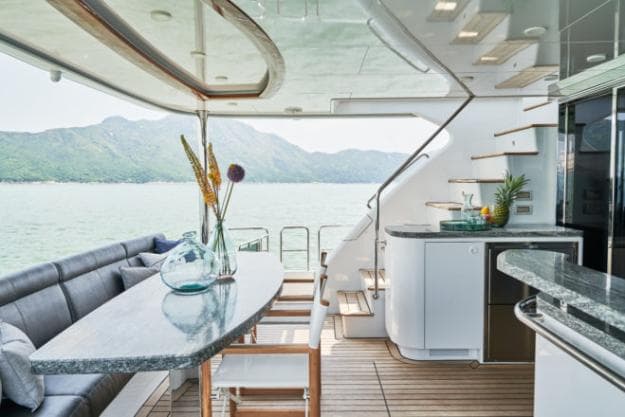 The aft cockpit has a wide granite table and convenient features like a bar and fridge