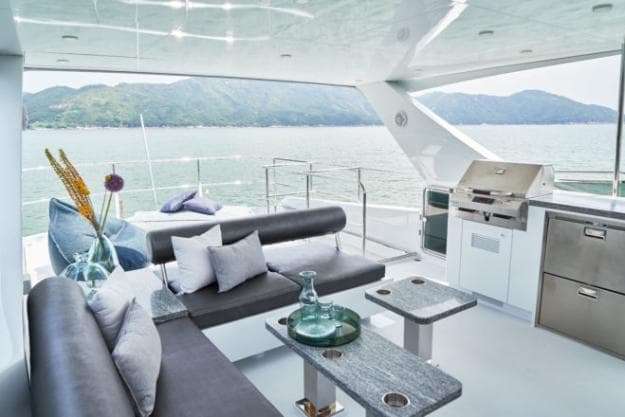 The flybridge has an L-shaped sofa, with an adjustable backrest on the aft seating