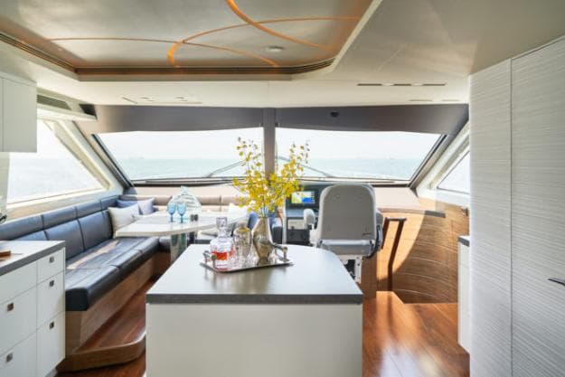 The island counter provides a social hub by the galley and dining table