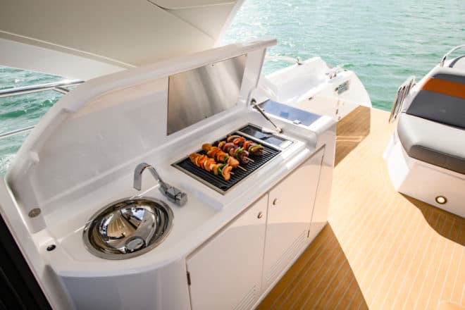 The Sunseeker Predator 60 Evo aft cockpit features a barbecue and a wet bar to starboard