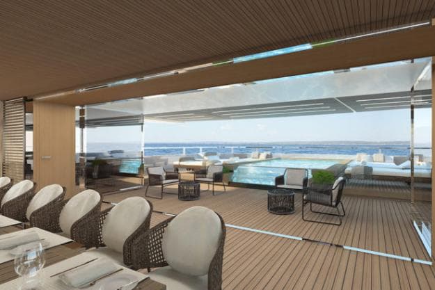 On the main deck, the dining area looks aft to the main guest pool