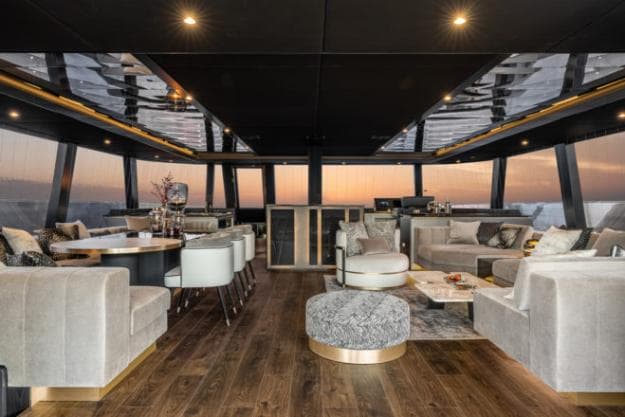 The saloon on the Sunreef 80 has decorative ceiling mirrors, while black, grey and gold dominate the décor