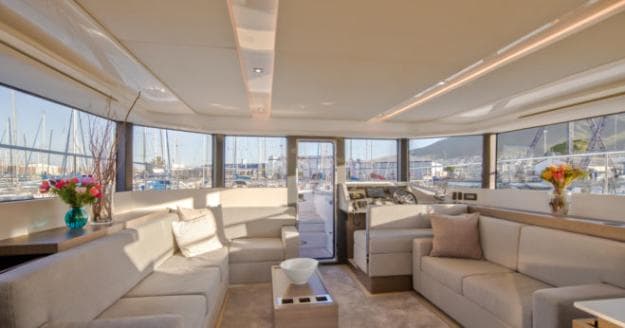 The well-lit saloon features quality joinery and carpeting, the latter one of many options on the first hull in Asia, such as a foldable dining table instead of a coffee table