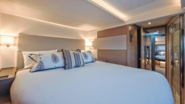 The forward (above) and aft (below) guest cabins in the port hull, which has a washer/dryer in the hallway