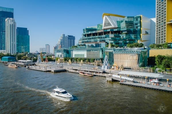A Jeanneau NC33 cruises the Chao Phraya river in Bangkok