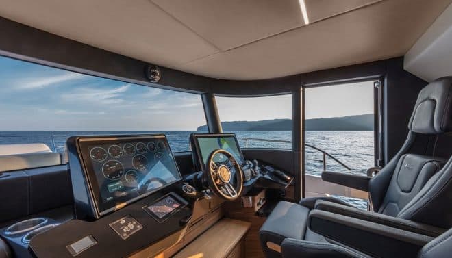 The raised pilothouse is a couple of steps up from the saloon and benefits from a side door