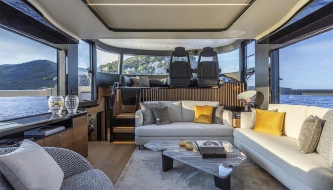 The saloon is furnished with pieces by Minotti, while the raised pilothouse has a curved windshield, a portside settee and twin helm seats