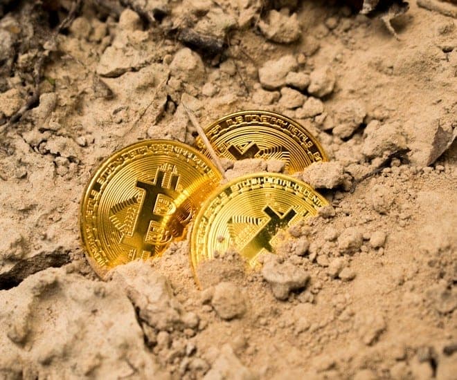 bitcoin in sand