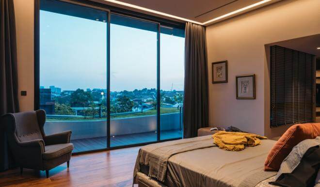 A stylish bedroom with a plush bed helps the homeowners to unwind after a day