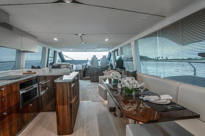 The aft galley neighbours the dining area, which has a leather sofa and stools Squadron 68