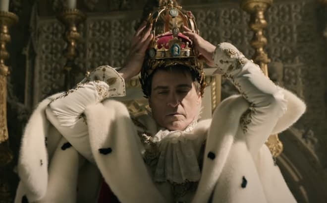 Joaquin Phoenix as Napoleon crowning himself as emperor of France in Ridley Scott's movie Napoleon 