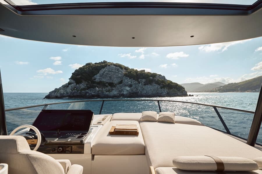 The flybridge includes a large lounging area and twin-seat upper helm forward