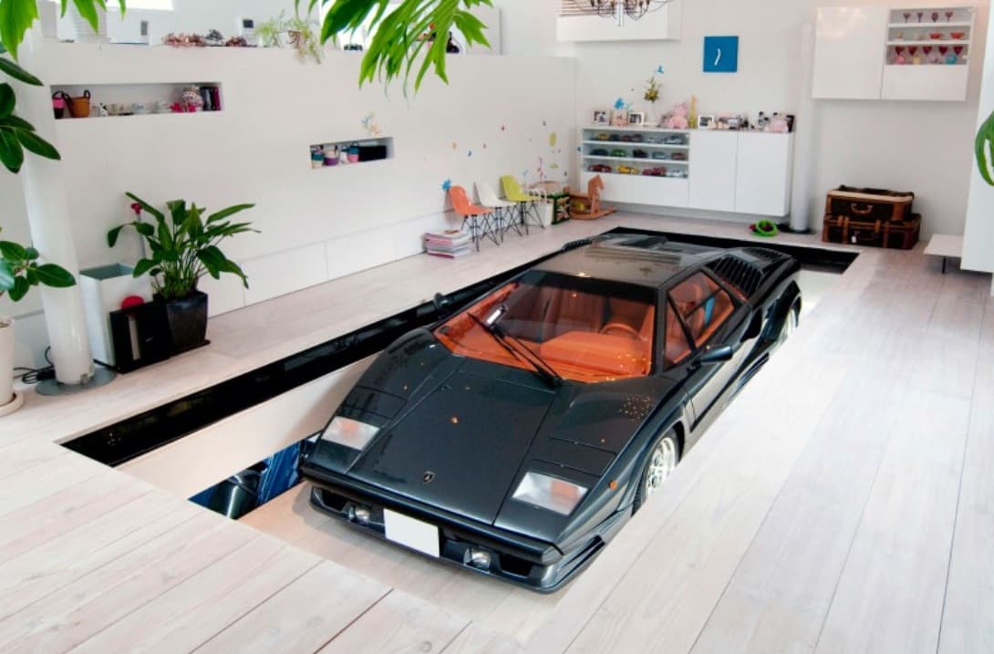 This London home's innovative lift ascends the car to the living area. Image: Dornob.com